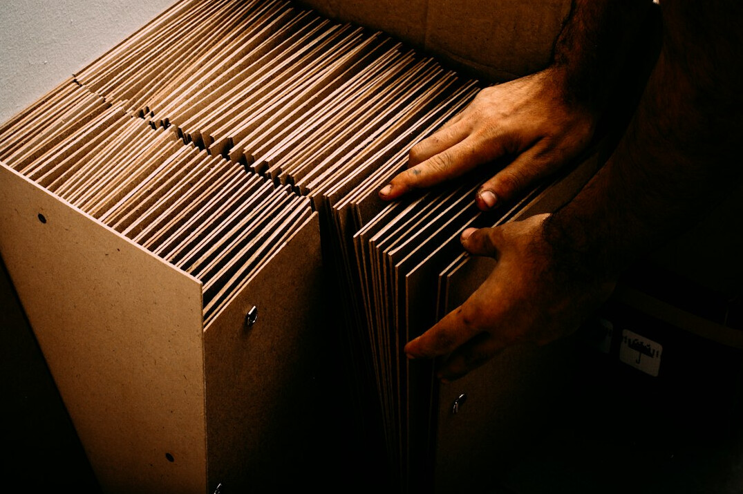 person organizing green files